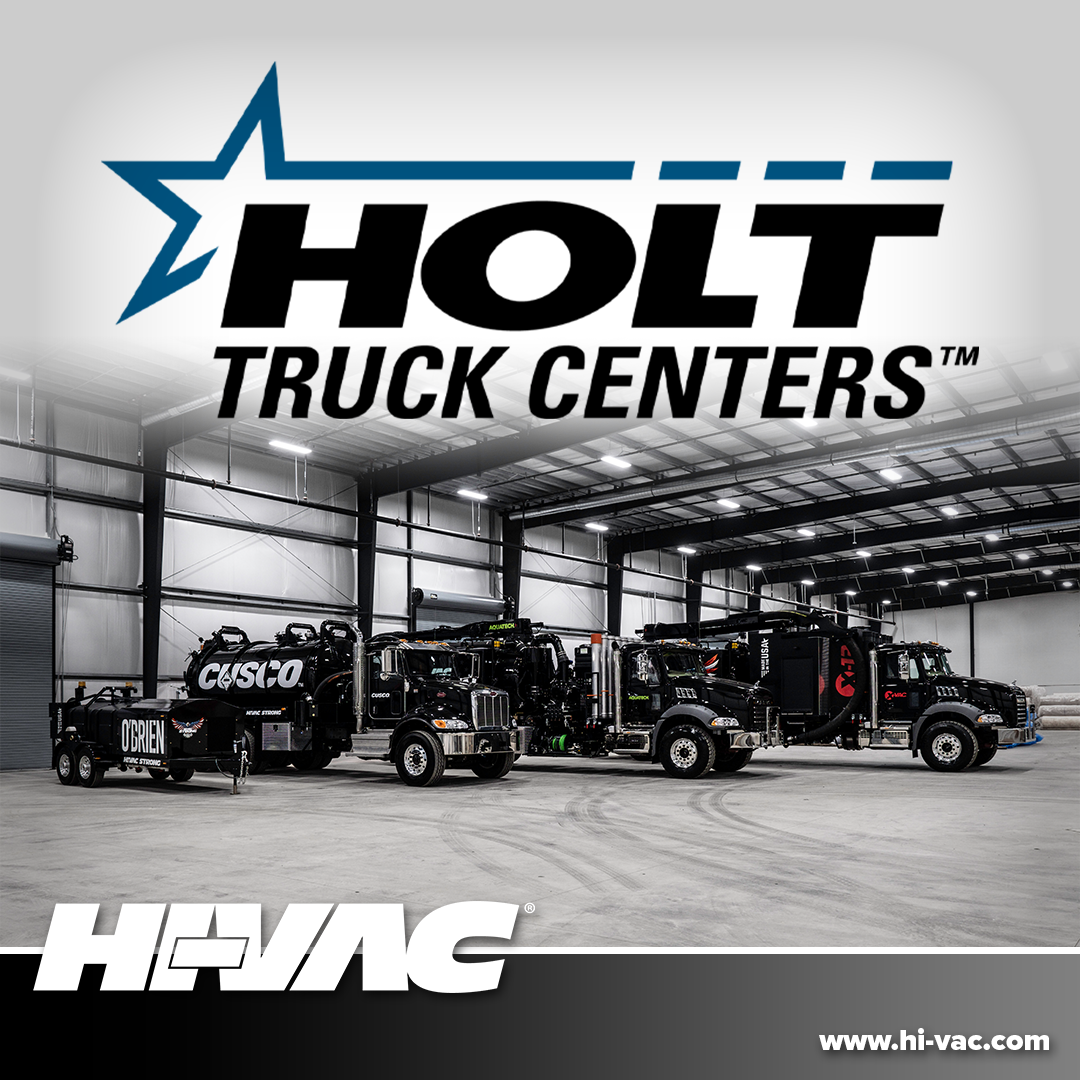 Three black Hi-Vac hydro-excavation vacuum trucks parked in a Holt Truck Centers bay under Holt and Hi-Vac logos.